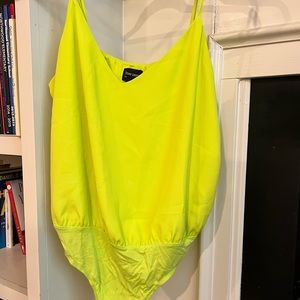 Bright yellow flowy body suit